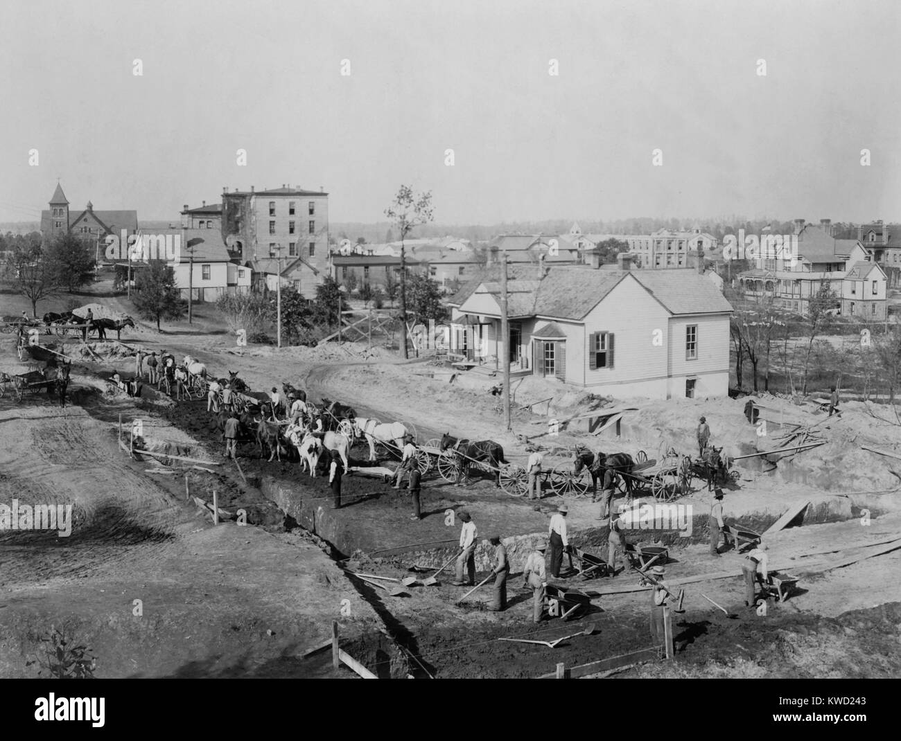 Tuskegee Institute students digging the foundations for Collis P. Huntington Memorial building, 1902. While working, they learned construction trade skills and erected the college building at a modest cost of $50,000. Huntington was one of the American philanthropists that contributed to the African American college. Photo by Frances Benjamin Johnston  (BSLOC 2017 20 130) Stock Photo