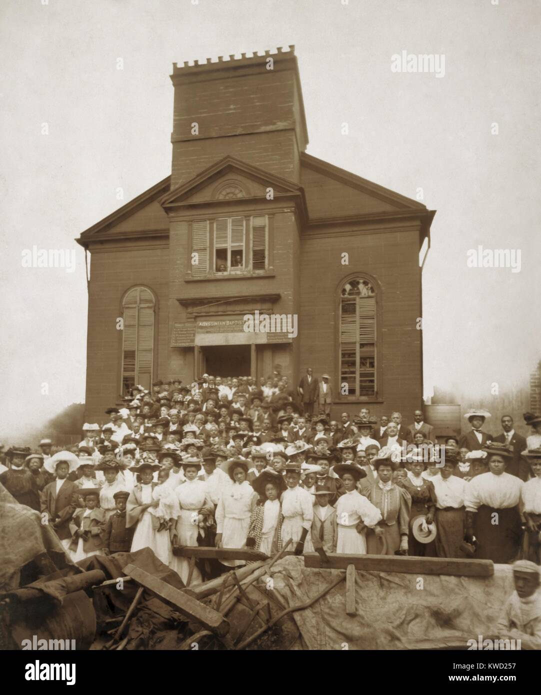 African-Americans in front of Abyssinian Baptist Church at Waverly Place, New York City, 1907. The congregation is posing for a farewell to the old church they built around 1860, in Greenwich Village, then the best African American neighborhood in Manhattan. In the 1900s the congregations was moving north to Harlem  (BSLOC 2017 20 151) Stock Photo