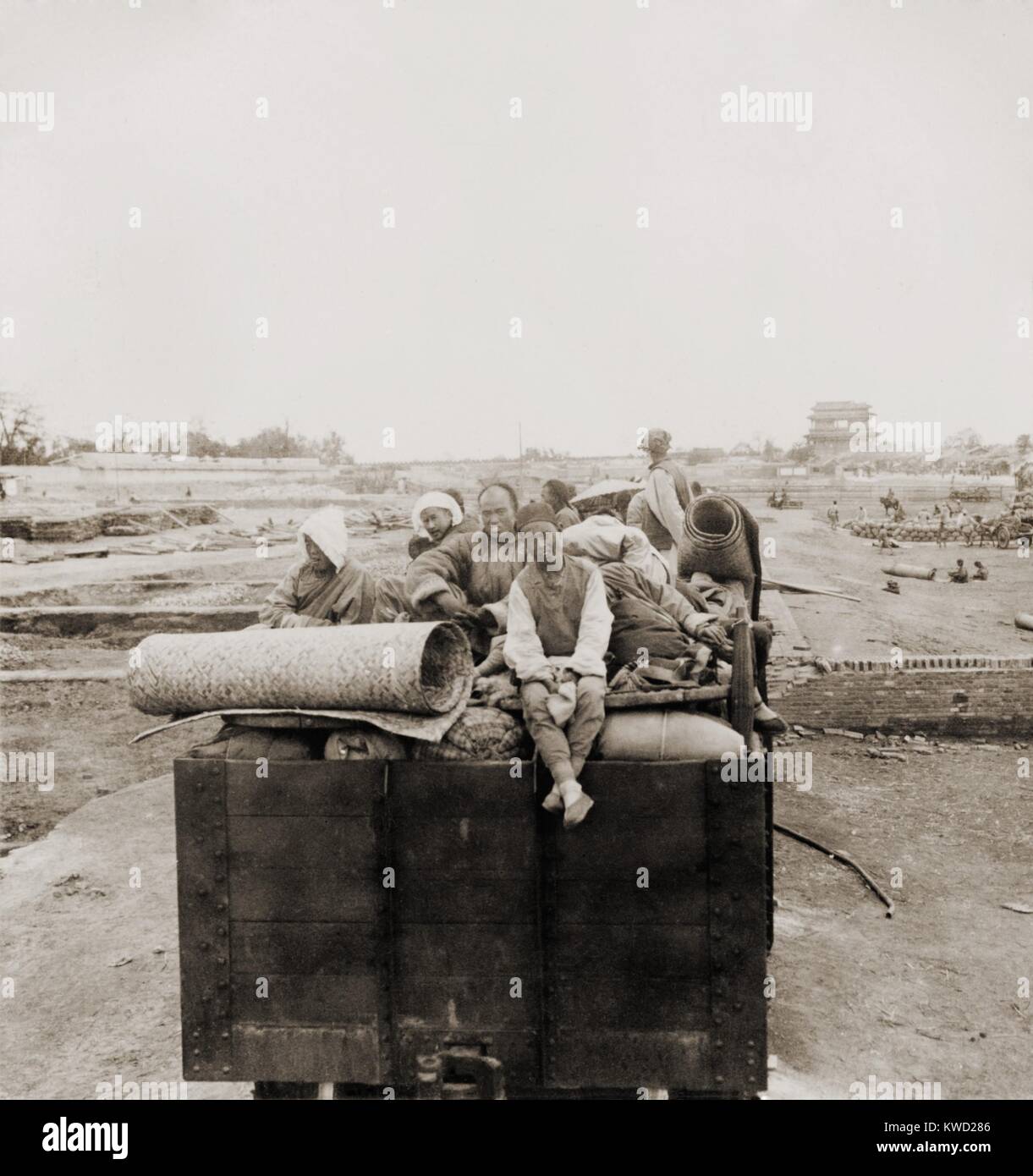 Chinese Christians fleeing Beijing during the Boxer Rebellion. In May 1900, the xenophobic, anti-European, anti-Christian Boxers took control of Beijing, threatening violence and death to Chinese Christians. The 1963 movie, 55 DAYS AT PEKING, was based on the war  (BSLOC 2017 20 4) Stock Photo