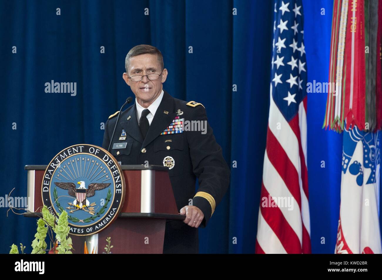 Lt. Gen. Michael Flynn speaks after assuming Directorship of Defense Intelligence Agency, July 24, 2012. He served from July 2012 until August 1914, when he retired from the military. His early departure was, in part, due to his conviction that the danger from radical Islamic terrorism was increasing after the death of Osama bin Laden.  (BSLOC 2017 20 120) Stock Photo