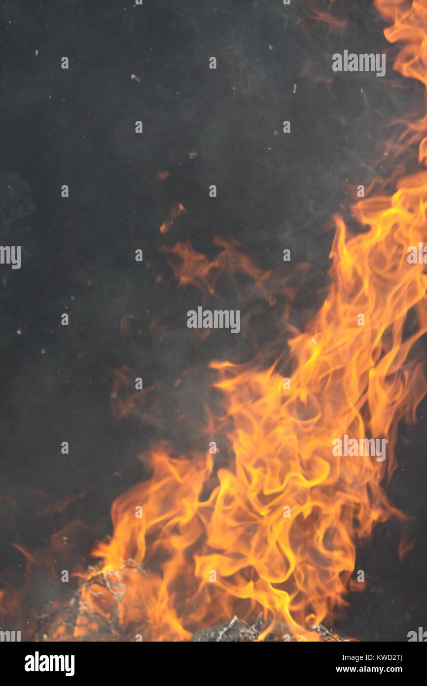 Fire Flames against dark background Stock Photo