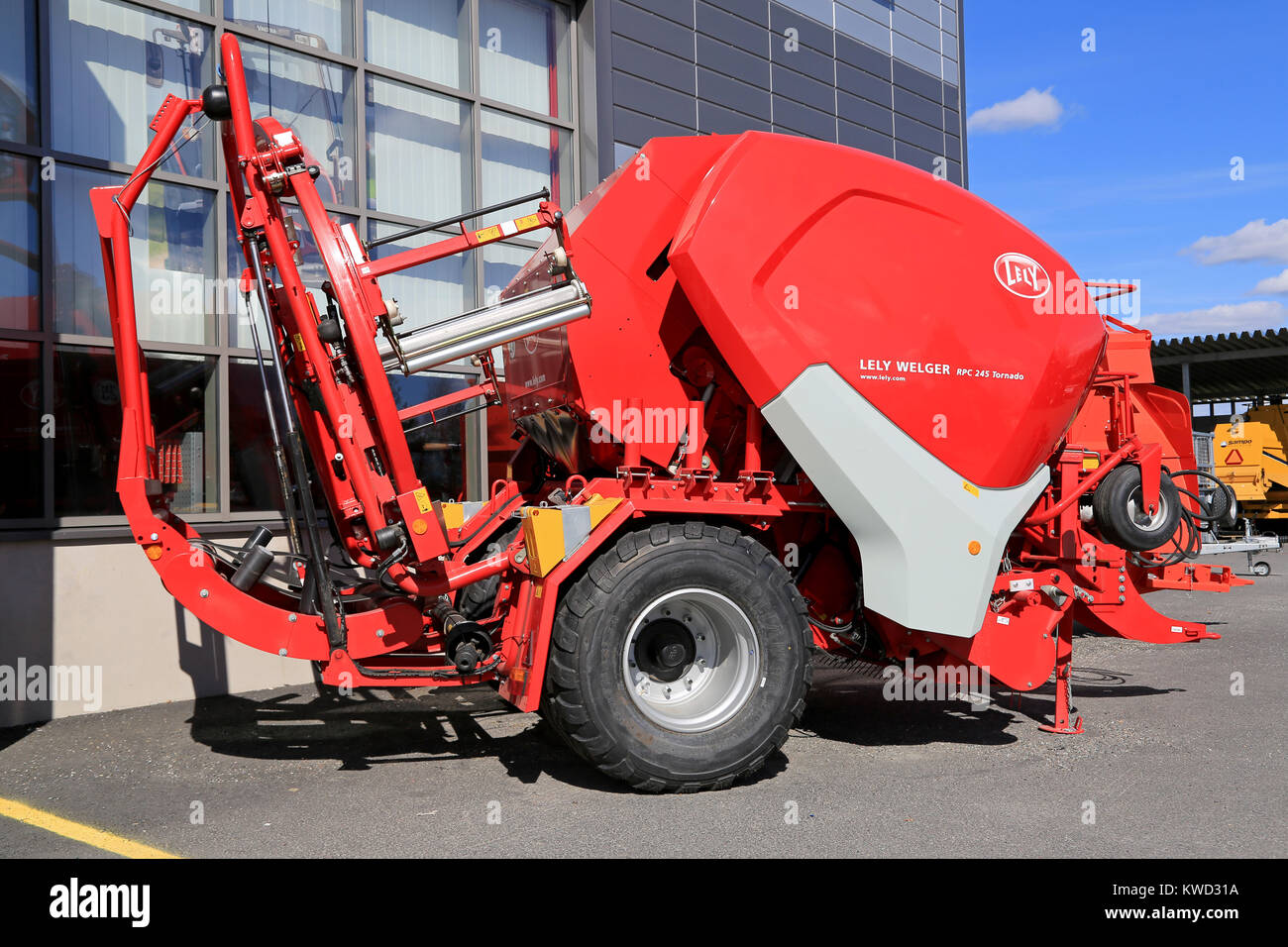 LOIMAA, FINLAND - APRIL 25, 2015: Lely Welger RPC 245 Tornado baler wrapper machine on a yard. The technology incorporated in this machine made it the Stock Photo