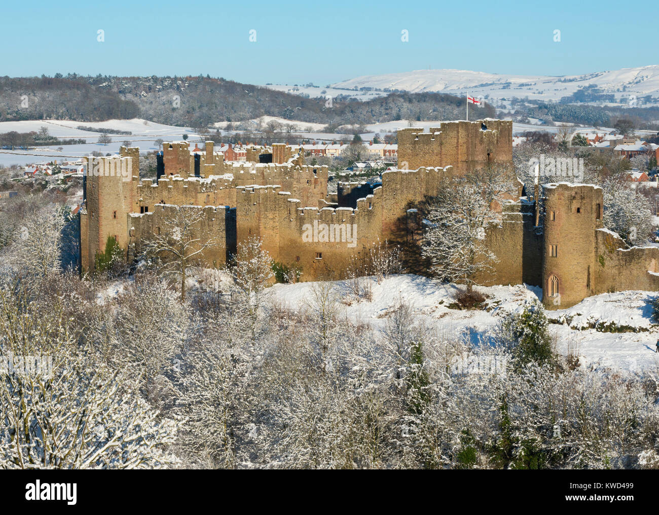 Ludlow Castle under a blanket of snow seen from Whitcliffe Common, Shropshire, England, UK Stock