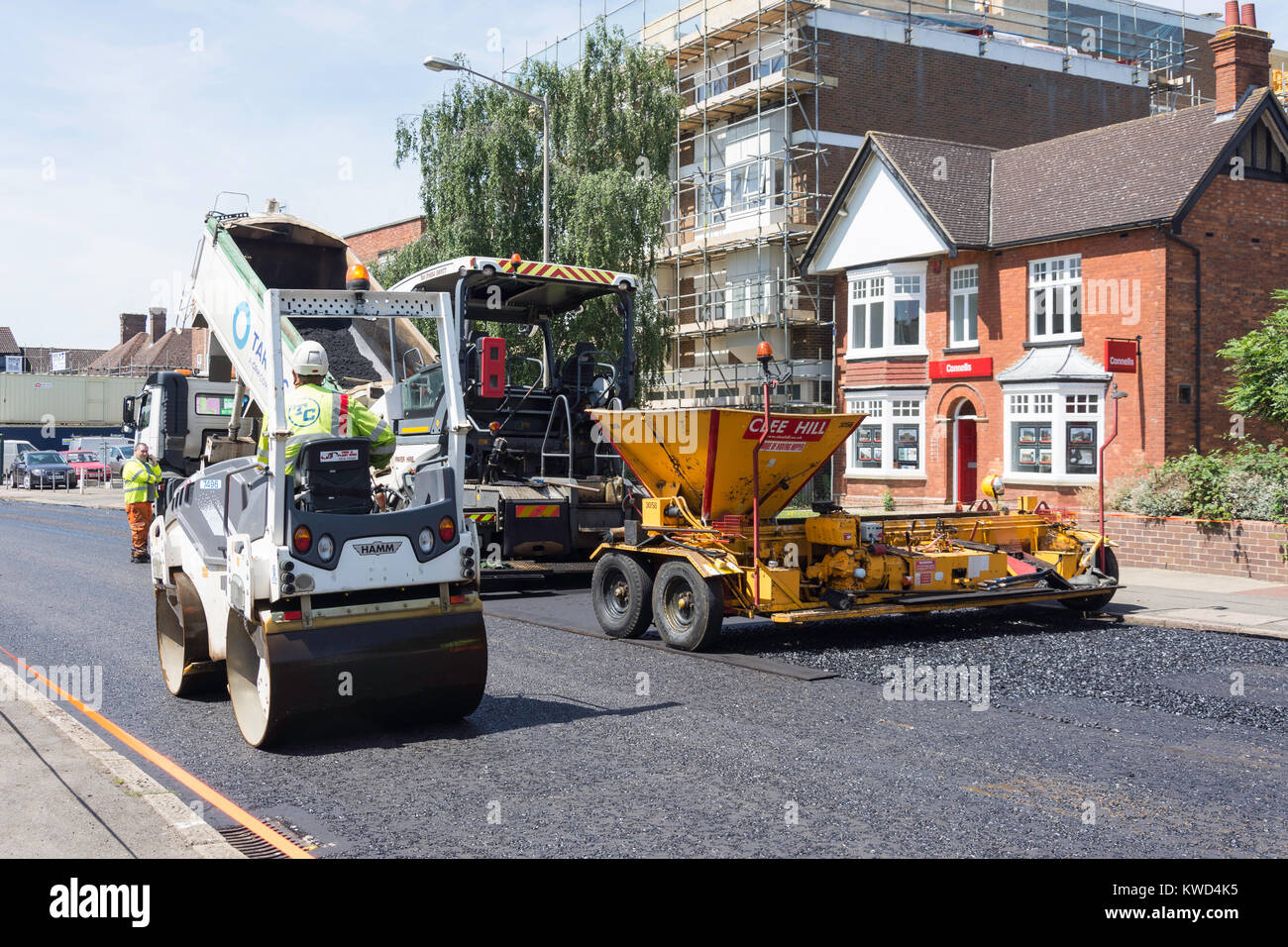 Road resurfacing machinery at work, Queensway, Bletchley, Milton Keynes, Buckinghamshire, England, United Kingdom Stock Photo