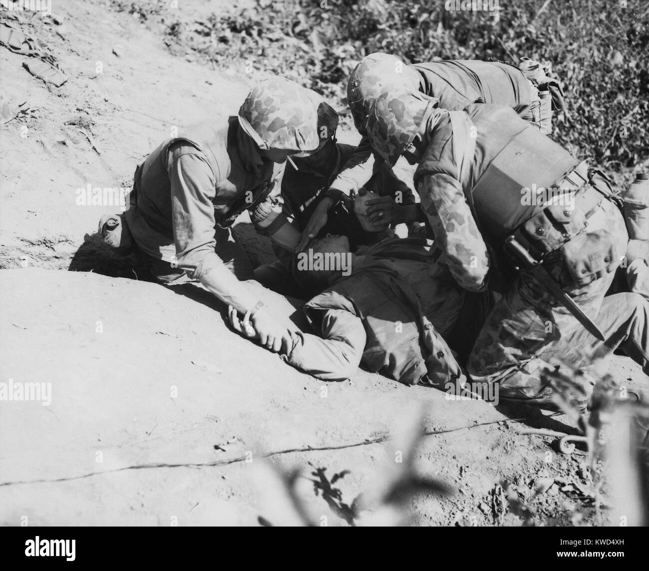 U.S. Marine wounded on Hook Ridge, May 28–29, 1953. In the last months before the armistice was signed, Communists troops renewed bitter fighting to gain final ground and victory claims. Korean War, 1950-53. (BSLOC 2014 11 126) Stock Photo