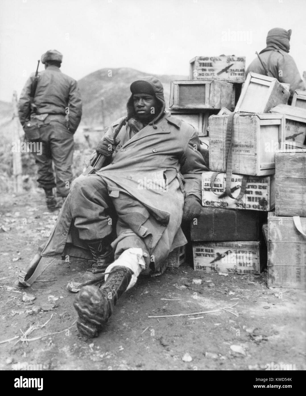 U.S. soldier of the 24th Infantry Regiment wounded in the leg on Feb. 16, 1951. Now regrouped after the failed UN invasion of North Korea, they were blocking the North Korean/Chinese forces advance into South Korea. Korean War, 1950-53. (BSLOC 2014 11 189) Stock Photo