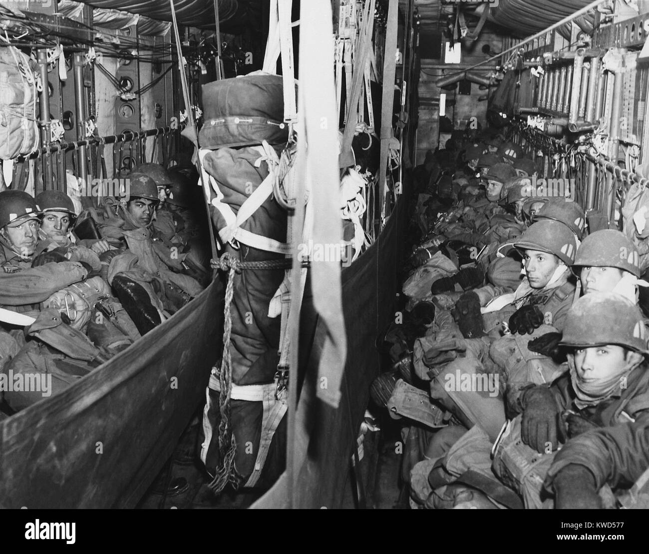 U.S. Airborne combat team en route to a drop zone at Munsan-ni, Korea, on March, 22, 1951. Packed into a C-119 Flying Boxcar, they jumped on the south bank of the Imjin River, 20 miles behind front line. Their mission to trap Communist forces retreating from Seoul was only partially successful because the enemy had already left. Korean War, 1950-53. (BSLOC 2014 11 217) Stock Photo