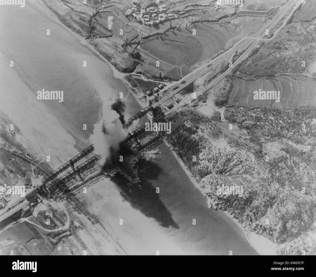 U.S. Bombing of Kum River bridges about 10 miles north of Taejon, Korea. Radio-controlled bombs were used for precision strikes, mostly for demolishing major bridges during the Korean War. Ca. July 1950. (BSLOC 2014 11 223) Stock Photo