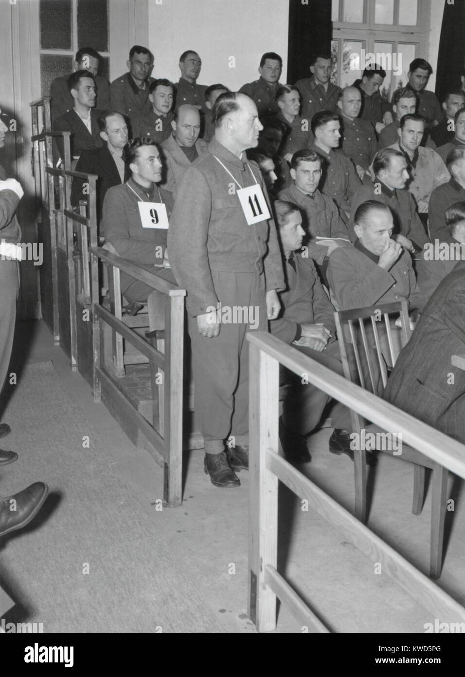 Josep Dietrich, Commander of the 6th Nazi SS Panzer Army, on trial for Malmedy Massacre. Standing with #11 hanging around his neck, he was the highest ranking of the 73 defendants. May 16, 1946. (BSLOC 2014 13 5) Stock Photo