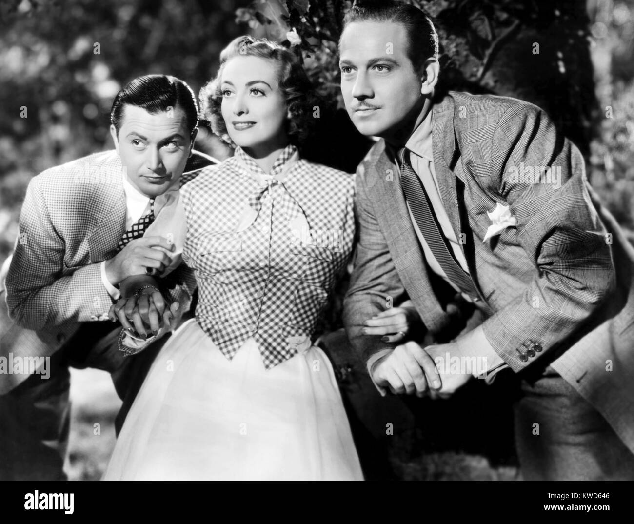 THE SHINING HOUR, from left, Robert Young, Joan Crawford, Melvyn ...