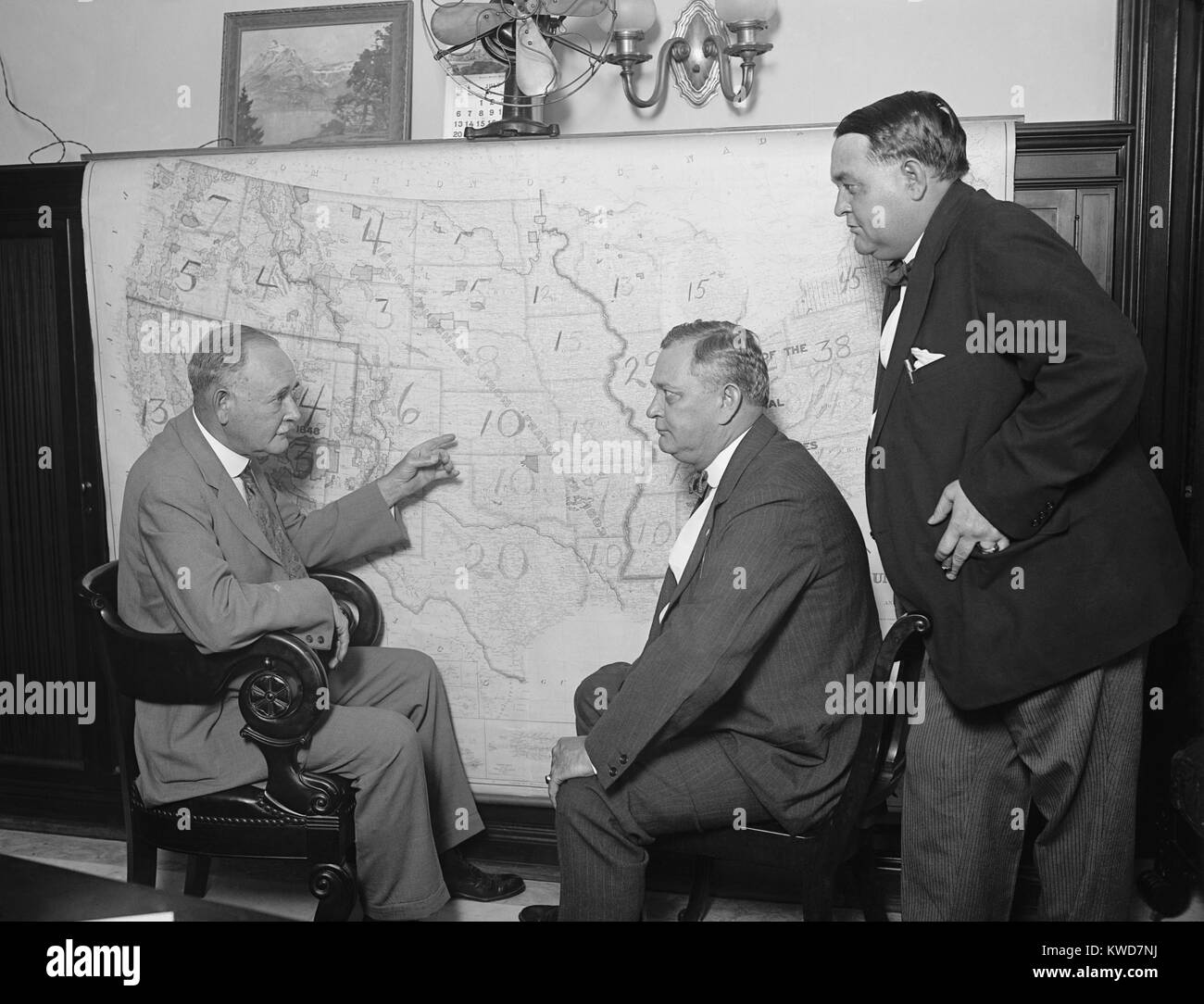1924 Democratic Senatorial Campaign Committee at a map. In the Coolidge landslide, the Democrats lost four seats in Senate, and remained the minority party with 41 seats to the 54 of the Democrats. (BSLOC 2015 16 113) Stock Photo