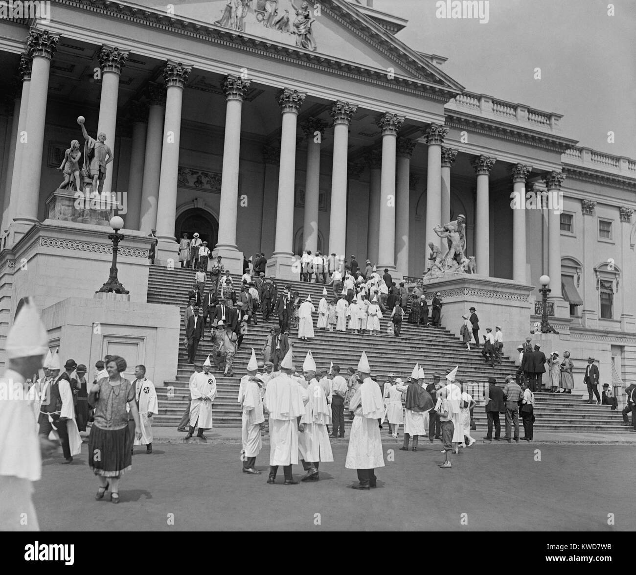 Ku Klux Klansmen visiting the U.S. Capitol during their mass gathering in Washington, D.C. August 8, 1925. They are unmasked but wear their robes and pointed hats. (BSLOC 2015 16 179) Stock Photo