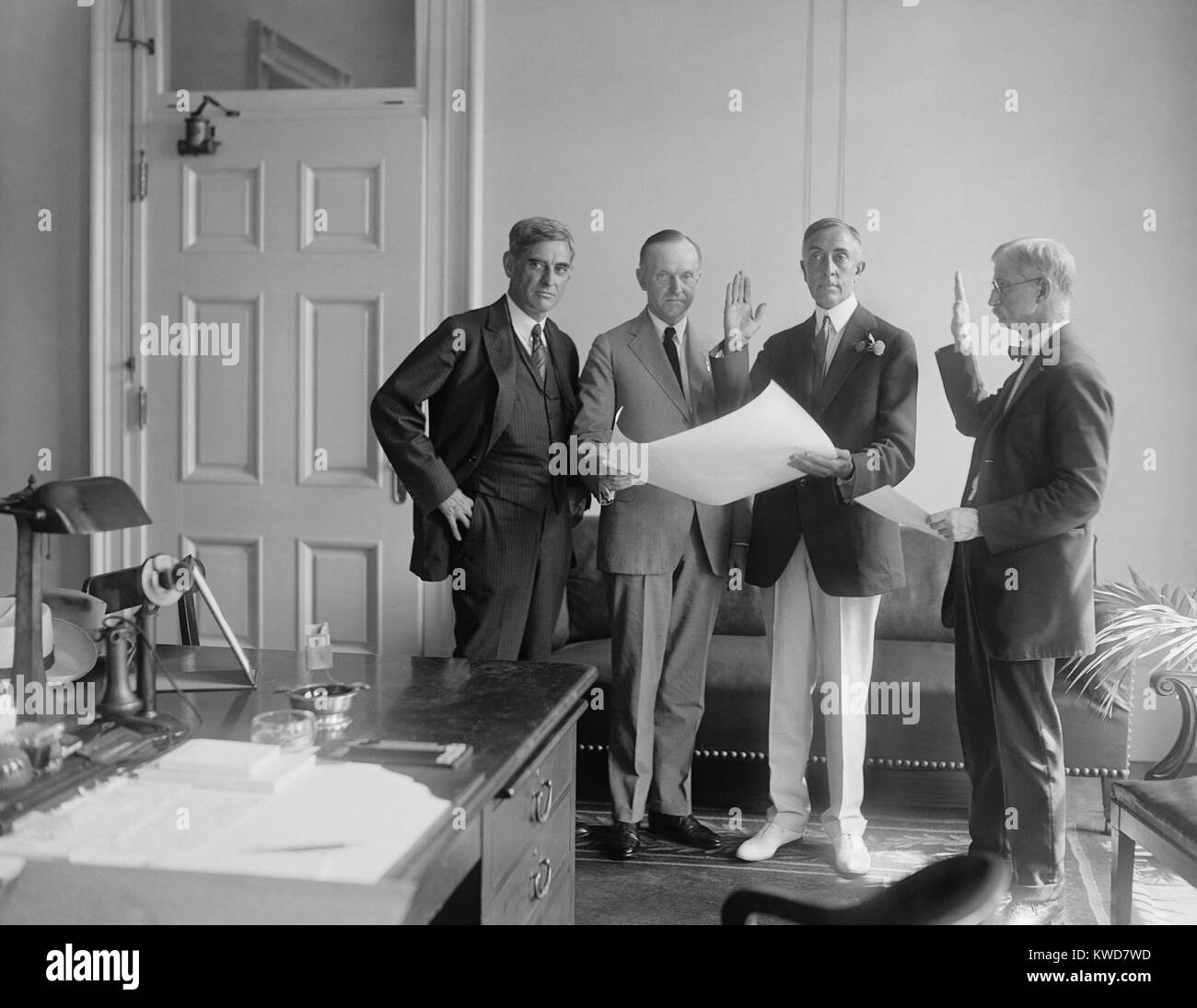 Campbell Bascom Slemp sworn in as Presidential Secretary to Calvin Coolidge, Sept 4, 1923. Slemp was a six-time Congressman from Virginia's 9th Congressional District from 1907 to 1923. L-R: George Christian, Sec. to the Late Pres. Harding; Pres. Coolidge; Bascom Slemp; Unidentified. (BSLOC 2015 16 18) Stock Photo