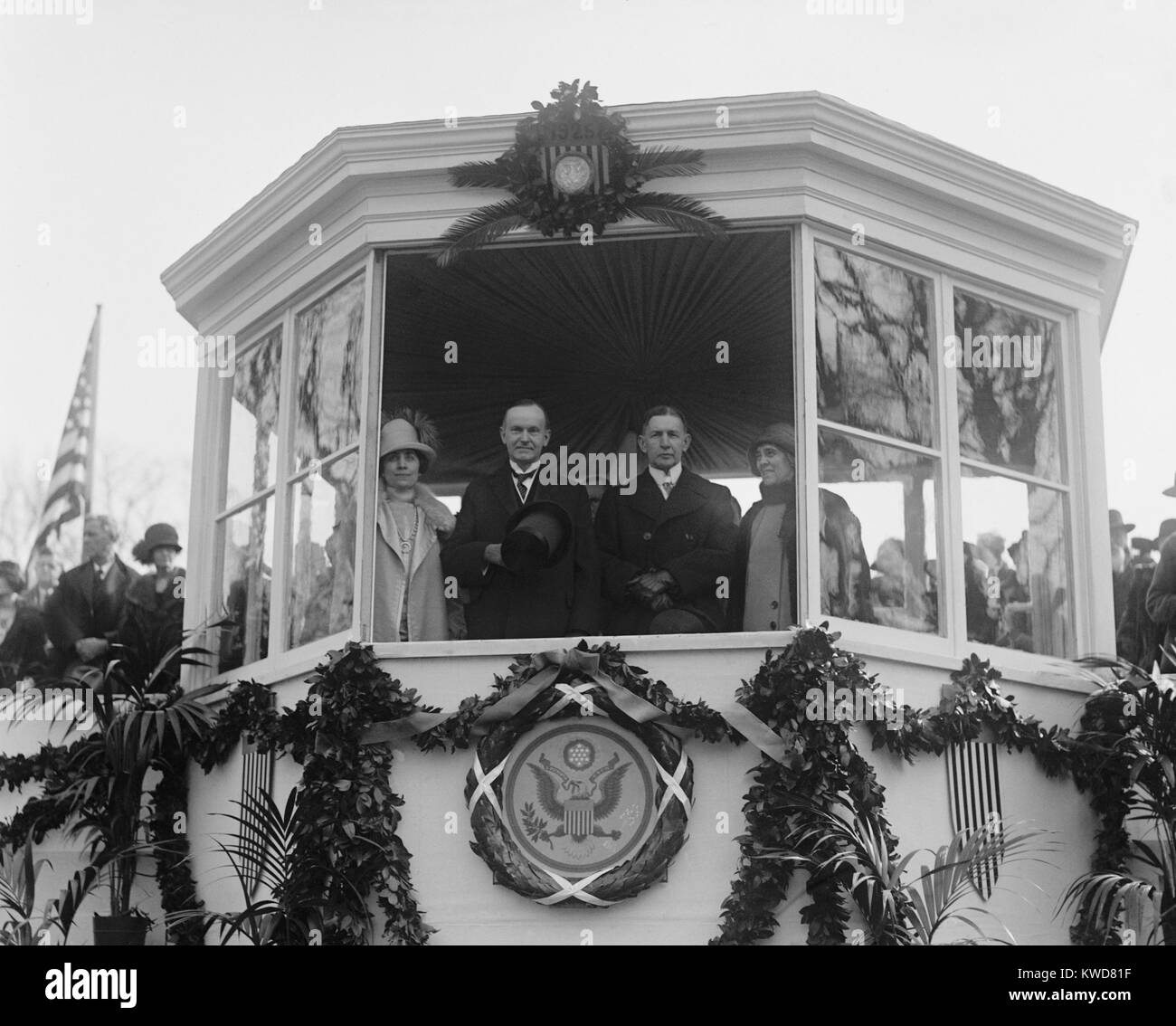 President Calvin Coolidge and VP Charles Dawes in the reviewing stand for their Inaugural Parade. Jan. 20, 1925. With them are their wives, Grace Goodhue Coolidge and Caro Blymyer Dawes. (BSLOC 2015 16 27) Stock Photo