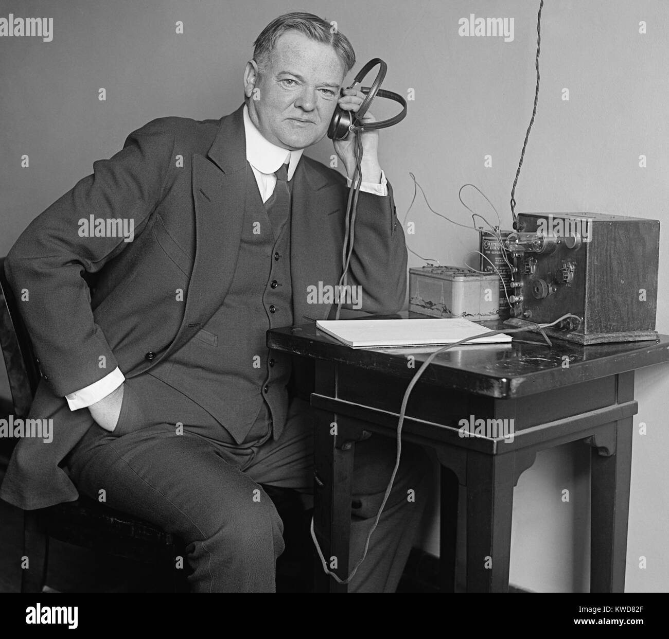 Herbert Hoover, Secretary of Commerce, listening to a radio on Dec. 31, 1924. (BSLOC 2015 16 50) Stock Photo