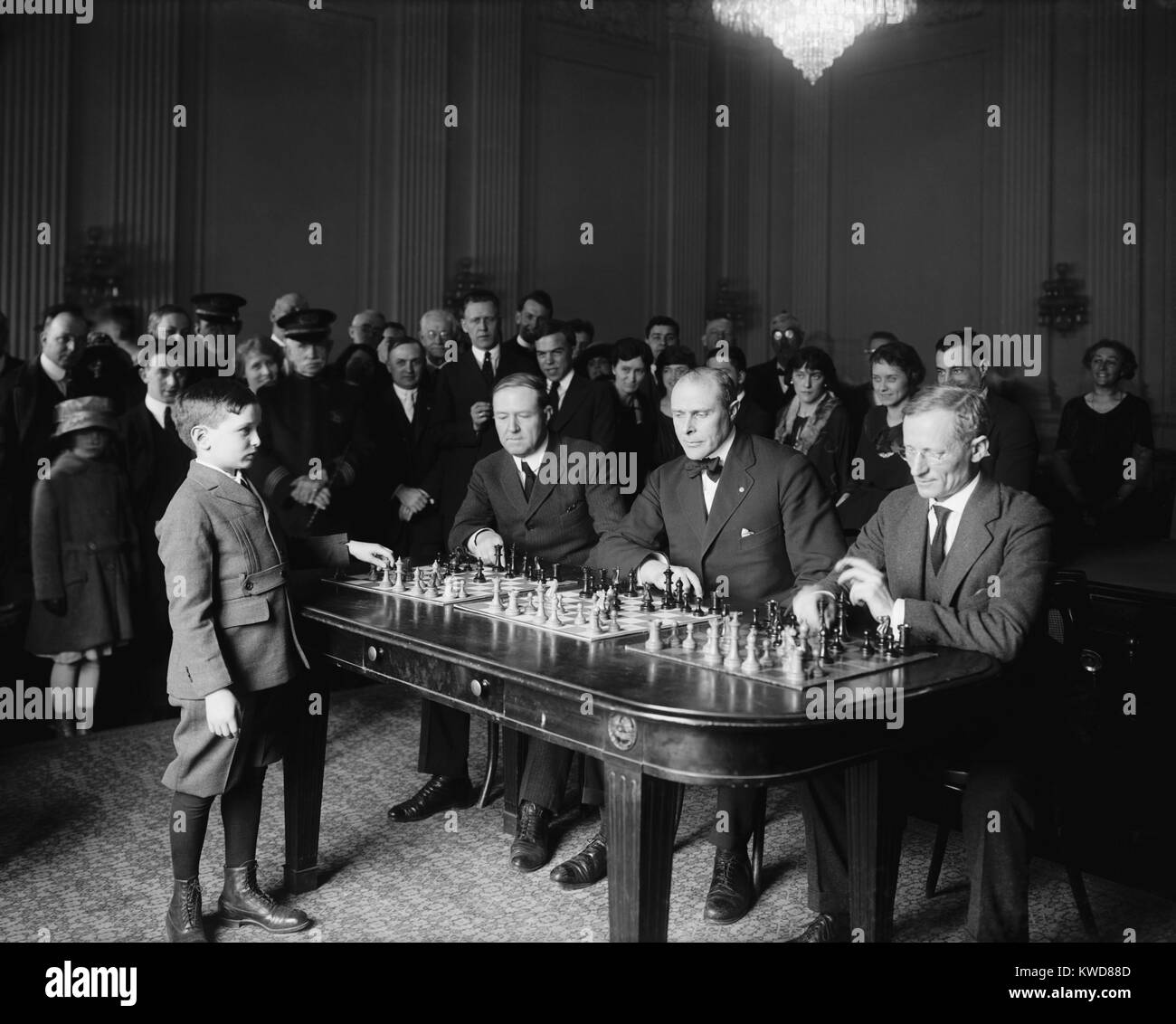 Chess prodigy, Samuel Herman Reshevsky, in a simultaneous chess exhibition match, April 6, 1922. The 10 year old was on an U.S. tour, where he won 1,491 of the 1,500 games he played against experts. (BSLOC 2015 17 162) Stock Photo