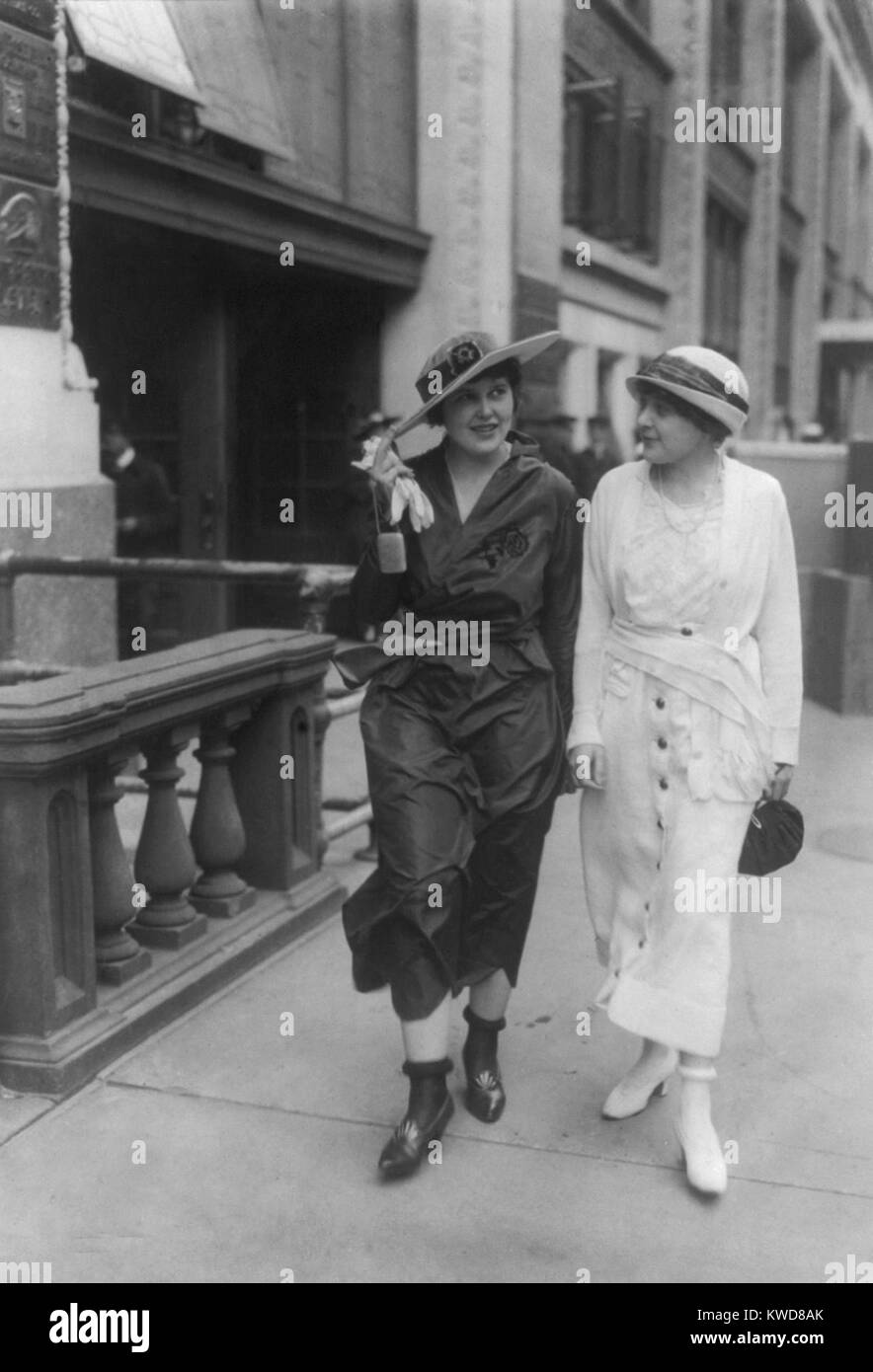 Two young women wearing their stockings 'rolled' above their ankles, ca.  1922-24. They rolled the length of their stockings around circular fabric  covered elastic bands worn to hold up stockings. The look
