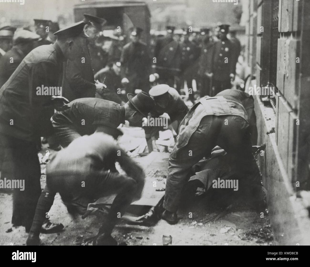 Police removing rubble to reach bodies after the Wall St. Bombing, Sept. 16, 1920, New York City. (BSLOC 2015 17 239) Stock Photo