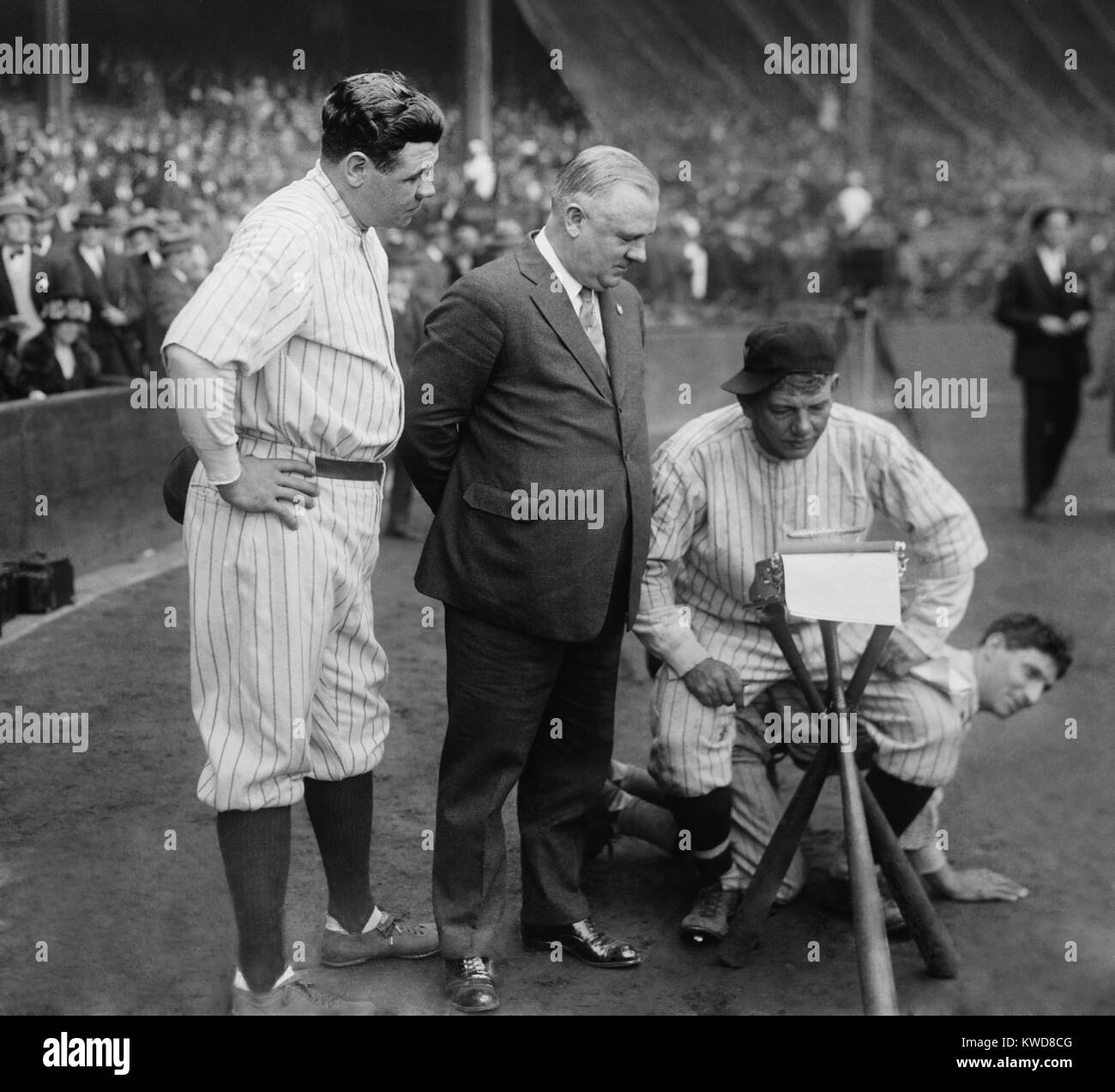 Washington Senators Pitcher Nick Altrock at they typewriter while sitting on teammate Al Schact. Looking on are Babe Ruth, and John McGraw during a post-season charity game. Oct. 23, 1923. (BSLOC 2015 17 25) Stock Photo