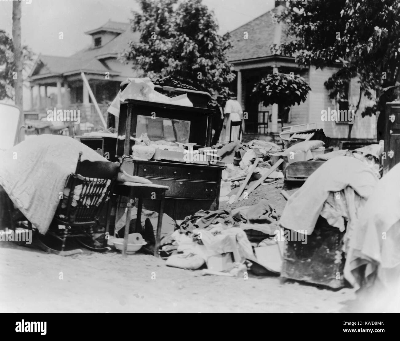 Furniture and belongings in Tulsa street during race riot of May 31 - June 1, 1921. Original caption states the owner was probably evicted during the riot. Photo by Alvin C. Krupnick Company, Tulsa, Okla. (BSLOC_2015_16_157) Stock Photo