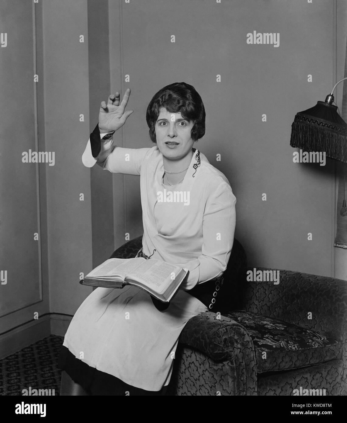 Aimee Semple McPherson, in a preaching pose, Feb. 14, 1927. She had recently emerged from a prosecutorial investigation of her alleged 1926 kidnap and disappearance (BSLOC 2016 8 124) Stock Photo