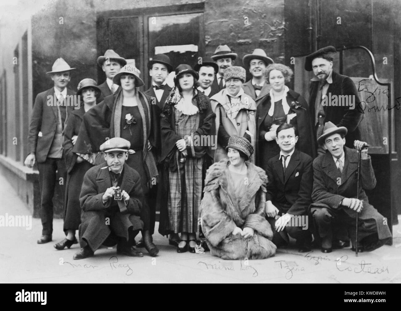 Group portrait of American and European artists and performers in Paris, 1920s. Names written on the photo identifying Avant Guard artist include: Man Ray, Mina Loy, Tristan Tzara, Jean Cocteau, Ezra Pound, Jane Heap, Kiki, and Martha Dennison (BSLOC 2016 8 135) Stock Photo