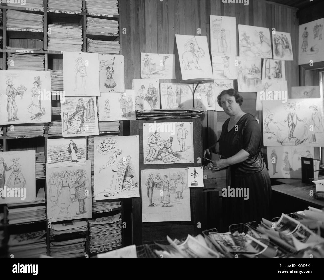 Suffragist political cartoons in offices of THE SUFFRAGIST. It was the newspaper of the Congressional Union for Woman Suffrage from 1913-1920 and then of the National Women's Party until 1923. (BSLOC 2015 16 204) Stock Photo