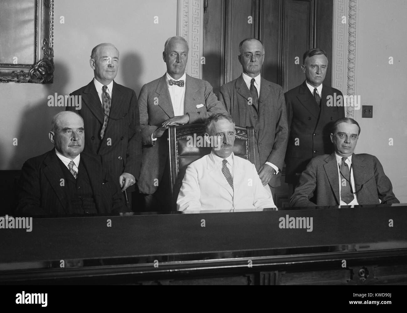 American Reparations Commission, June 25, 1929. They negotiated a settlement among the European nations for adjustment in German reparations payments. Front, L-R: J. Pierpont Morgan Jr., Sec. Henry Stimson, and Owen D. Young. Back, L-R: Thomas W. Lamont, (BSLOC 2016 8 21) Stock Photo