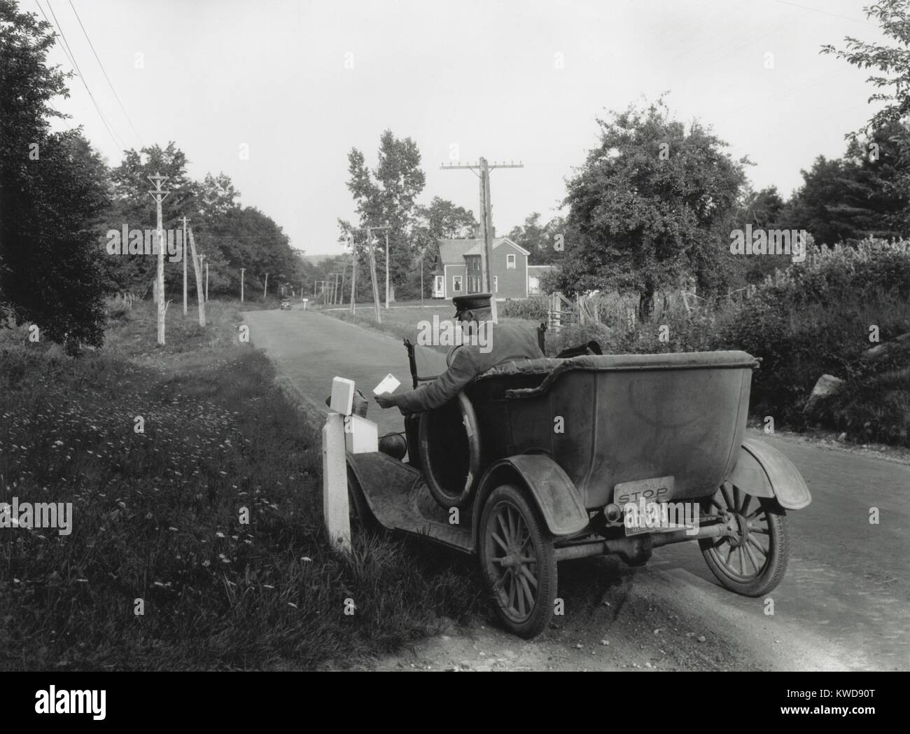 Post man delivering mail in rural, York County, Maine, Aug. 26, 1930. Rural Free Delivery became an official U.S. Post Office service in 1896. It allowed for delivery of magazines, newspapers, and mail-order goods and reduced rural isolation (BSLOC 2016 8 25) Stock Photo
