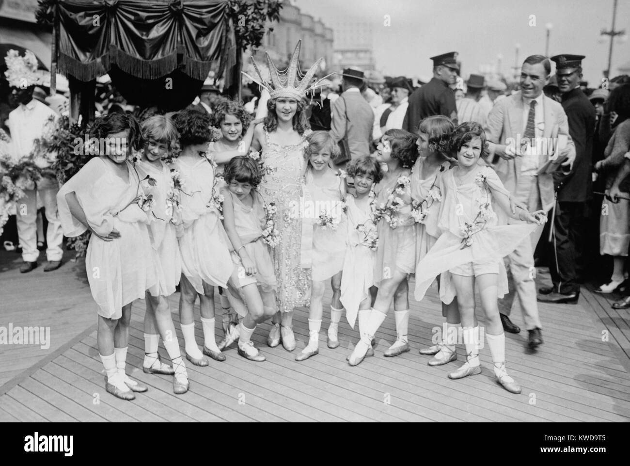 Margaret Gorman, the first Miss America of 1921. She is escorted by  garlanded young girls on the crowded boardwalk in Atlantic City, N.J.  (BSLOC 2015 17 207 Stock Photo - Alamy