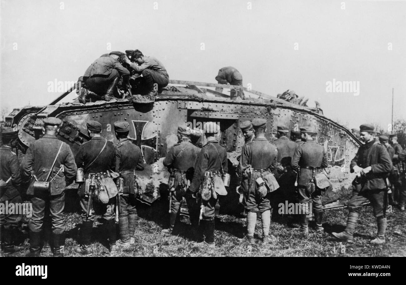 World War 1 Tanks. German soldiers standing on and around a tank with an Iron Cross insignia. It is one of approximately 50 British tanks captured, repaired, and used in battle by the Germans. Ca. 1917-18. (BSLOC 2013 1 157) Stock Photo