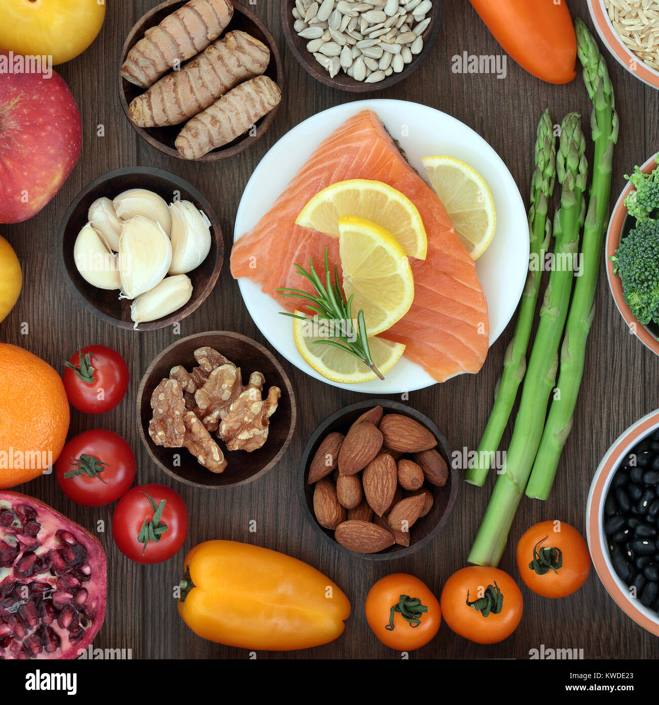 Heath food high in nutrients with fresh salmon, vegetables, fruit