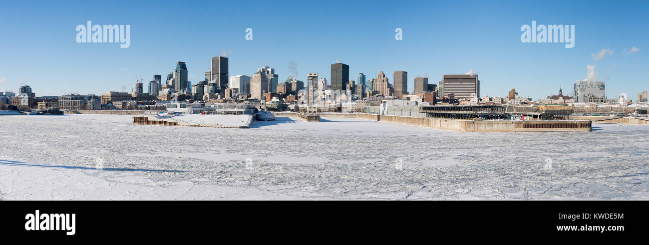 Montreal, CA - 1 January 2018: Montreal Skyline and Frozen St Lawrence River in winter Stock Photo