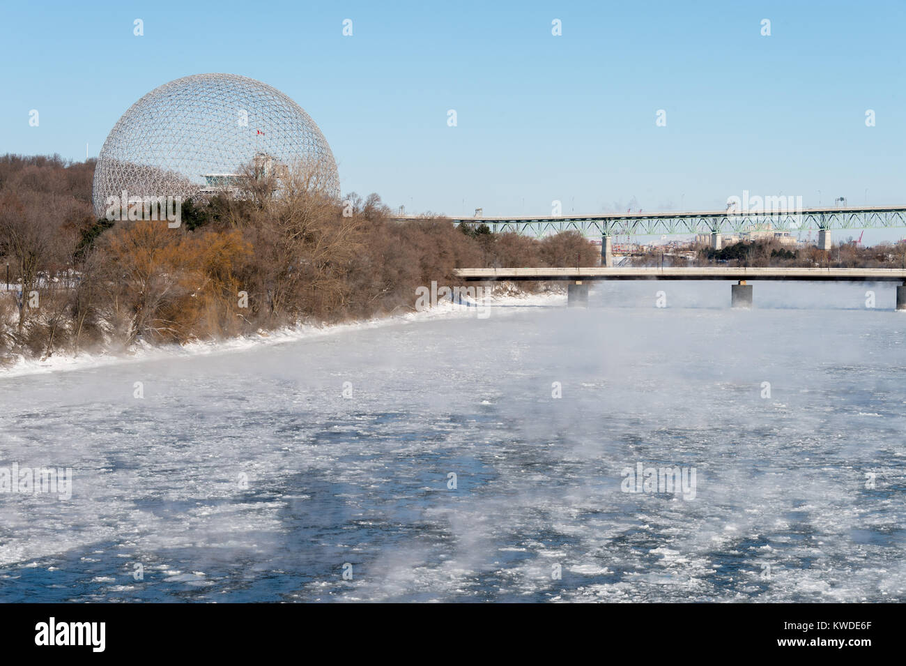 Montreal, CA - 1 January 2018: Montreal in winter, Biosphere in Parc Jean Drapeau as ice fog rises off the St. Lawrence River Stock Photo