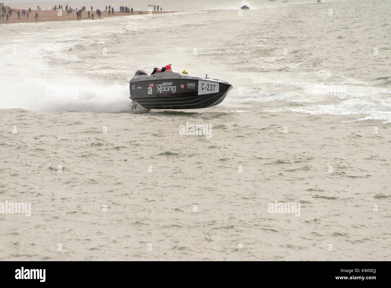 Entrant C-237 in the Exmoouth Power Boat and Ski Club Boxing Day Power Boat Race. Boat skimming water. Stock Photo