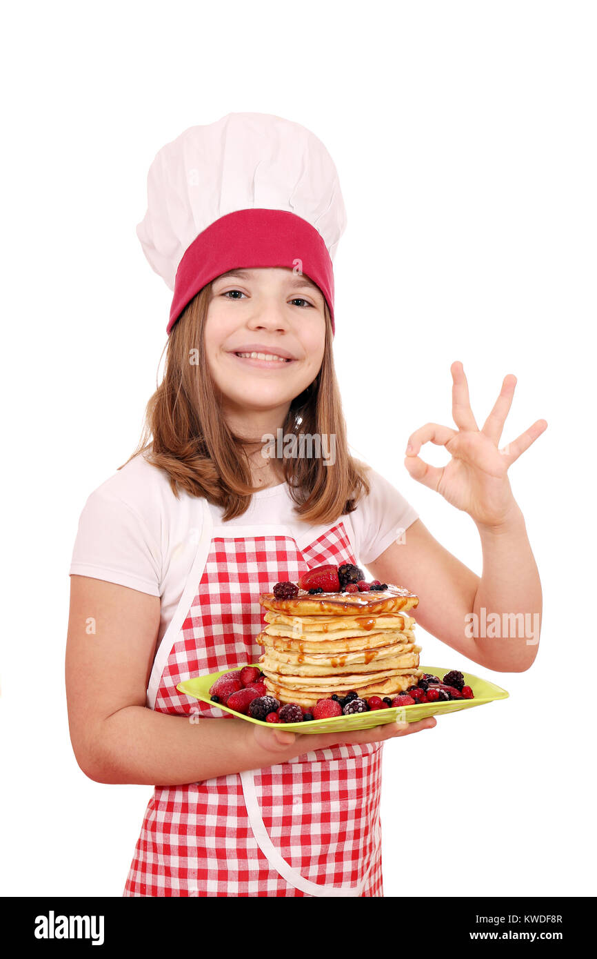 happy little girl cook with pancake and ok hand sign Stock Photo Alamy