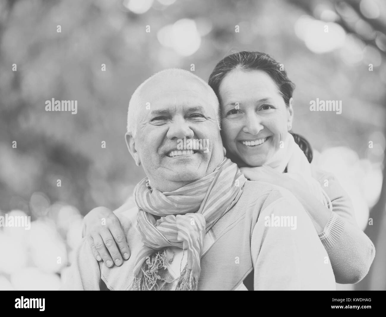 Portrait of cheerful senior couple together in autumn park Stock Photo