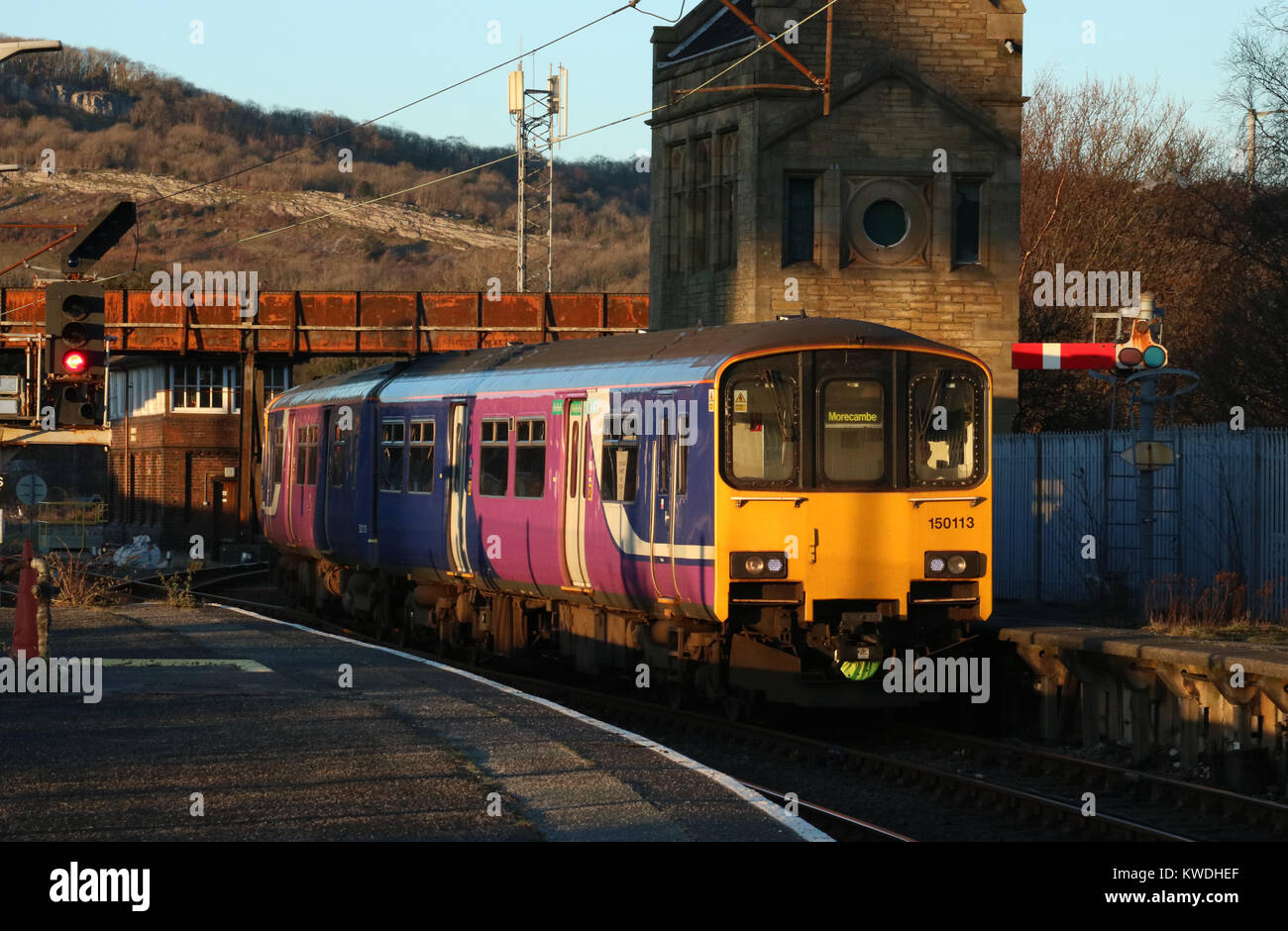 Class 150 diesel multiple unit at the front of a train arriving at ...