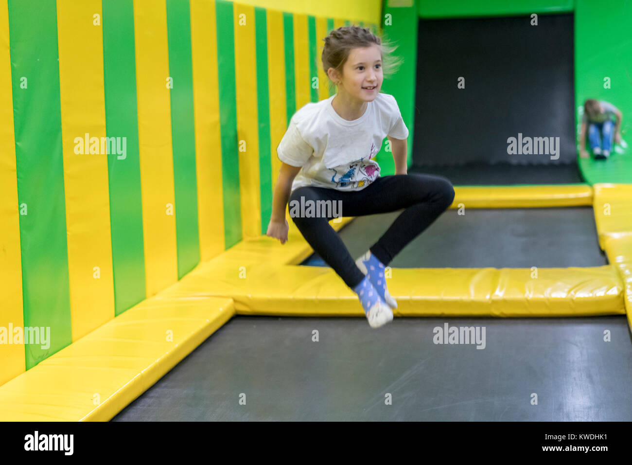 girl jumping on a trampoline Stock Photo