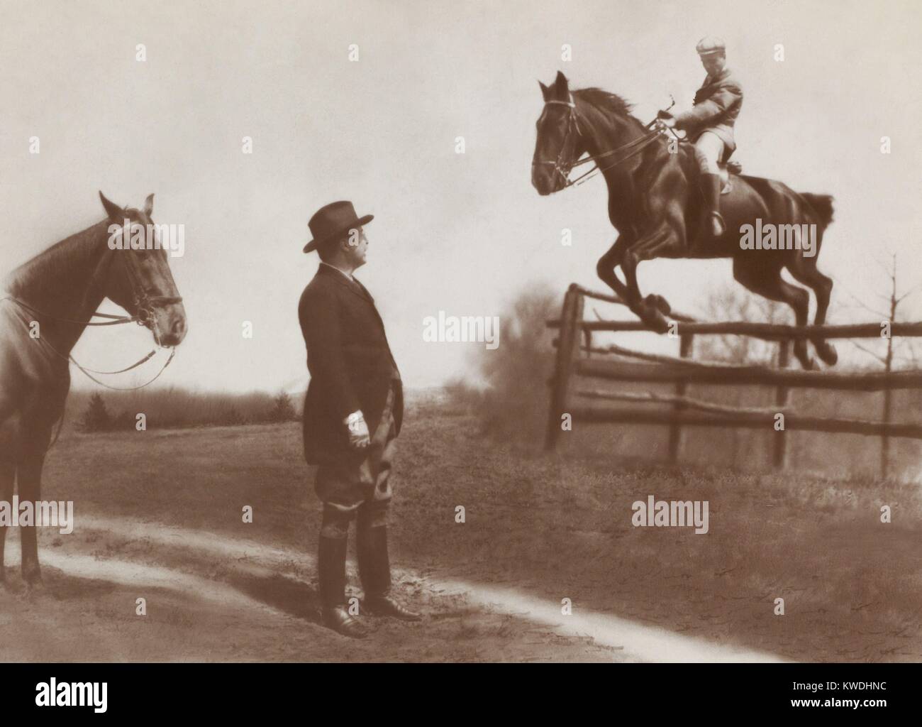 Theodore Roosevelt Jr., the Presidents oldest son, on horseback jumping a fence as his father watches. May 1907, at the Chevy Chase Club, Maryland (BSLOC 2017 6 85) Stock Photo