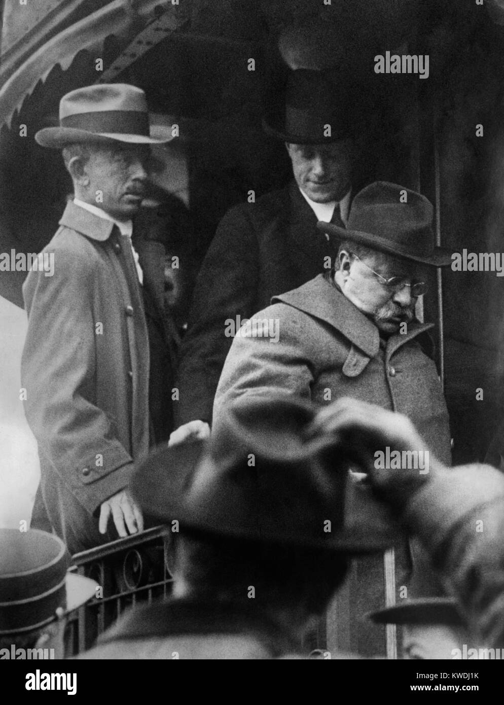Theodore Roosevelt arrives home on Oct. 22, 1912, after being shot in Milwaukee 6 days earlier. He was sidelined for another week, until his mass meeting at Madison Square Garden on Oct. 30th, five days before the election (BSLOC 2017 8 54) Stock Photo