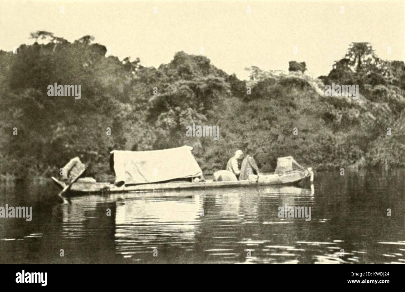 Canoe rigged with a cover under which sick Colonel Roosevelt travelled. At the end of the Roosevelt-Rondon Expedition, TR was seriously ill with an infected leg. April 1914 photo by naturalist, George Cherrie (BSLOC 2017 8 64) Stock Photo