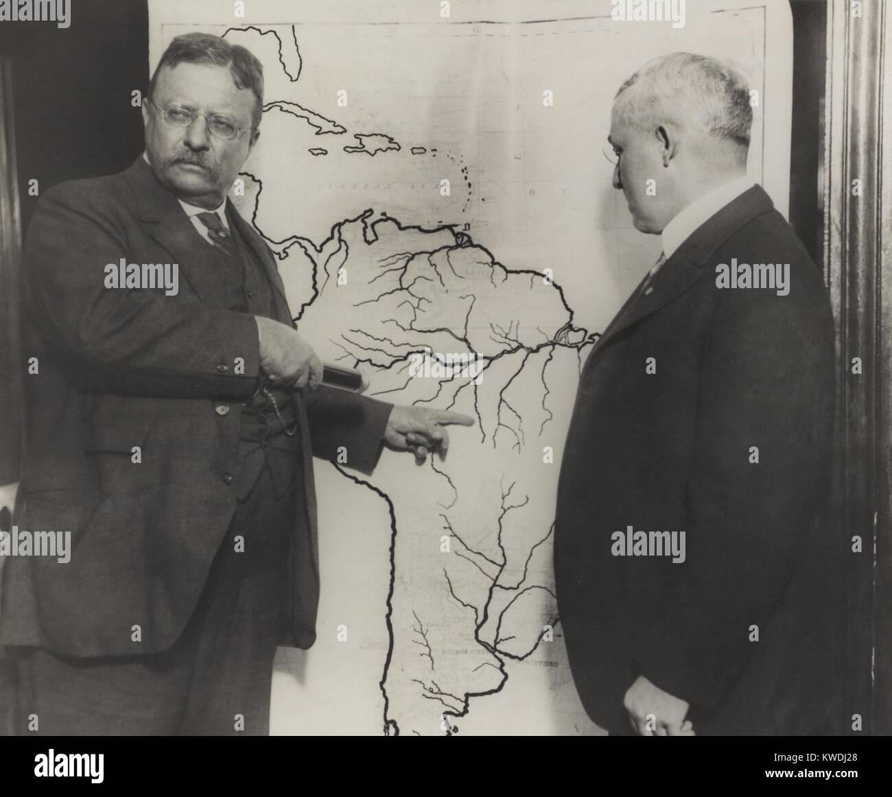 Theodore Roosevelt pointing at the area explored during the Roosevelt-Rondon Scientific Expedition. They explored the 1000-mile long River of Doubt, which was renamed River Roosevelt (BSLOC_2017_8_67) Stock Photo