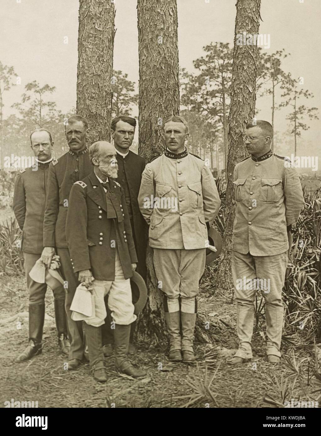 Staff of the 1st US Volunteer Regiment in Tampa Florida with Confederate General Joe Wheeler. Photo was taken in May 1898 before their embarkation for Cuba. L-R: Major Alexander Oswald Brodie; Taylor MacDonald, General Joe Wheeler (with beard); Journalist Richard Harding Davis; Col. Leonard Wood; Lt. Col. Theodore Roosevelt (BSLOC 2017 10 24) Stock Photo