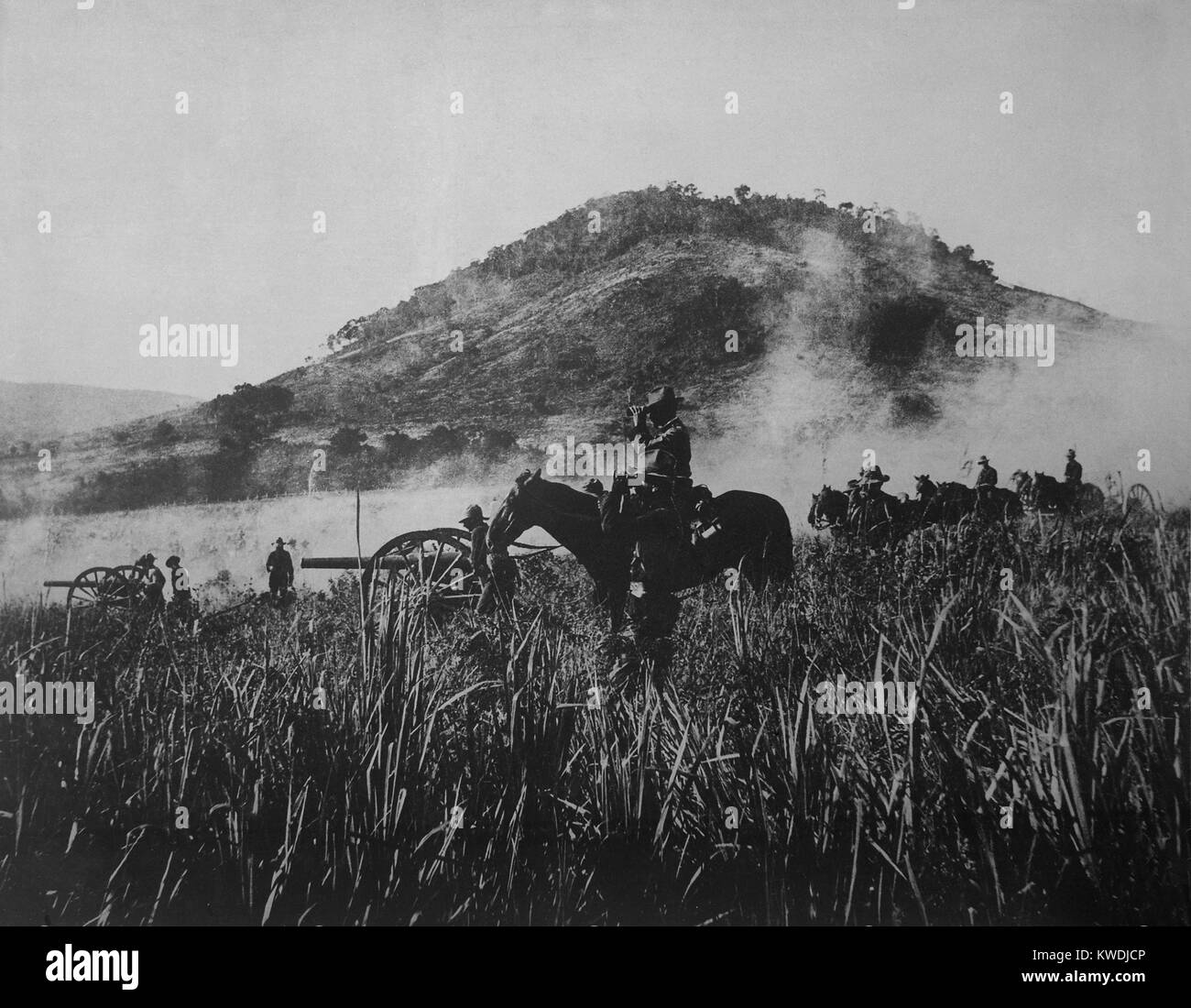 US artillery, shelling at Coamo, on August 9, 1898, while advancing into Puerto Rican interior. The American invaders opposition in inconclusive fighting during the Spanish American War (BSLOC 2017 10 53) Stock Photo