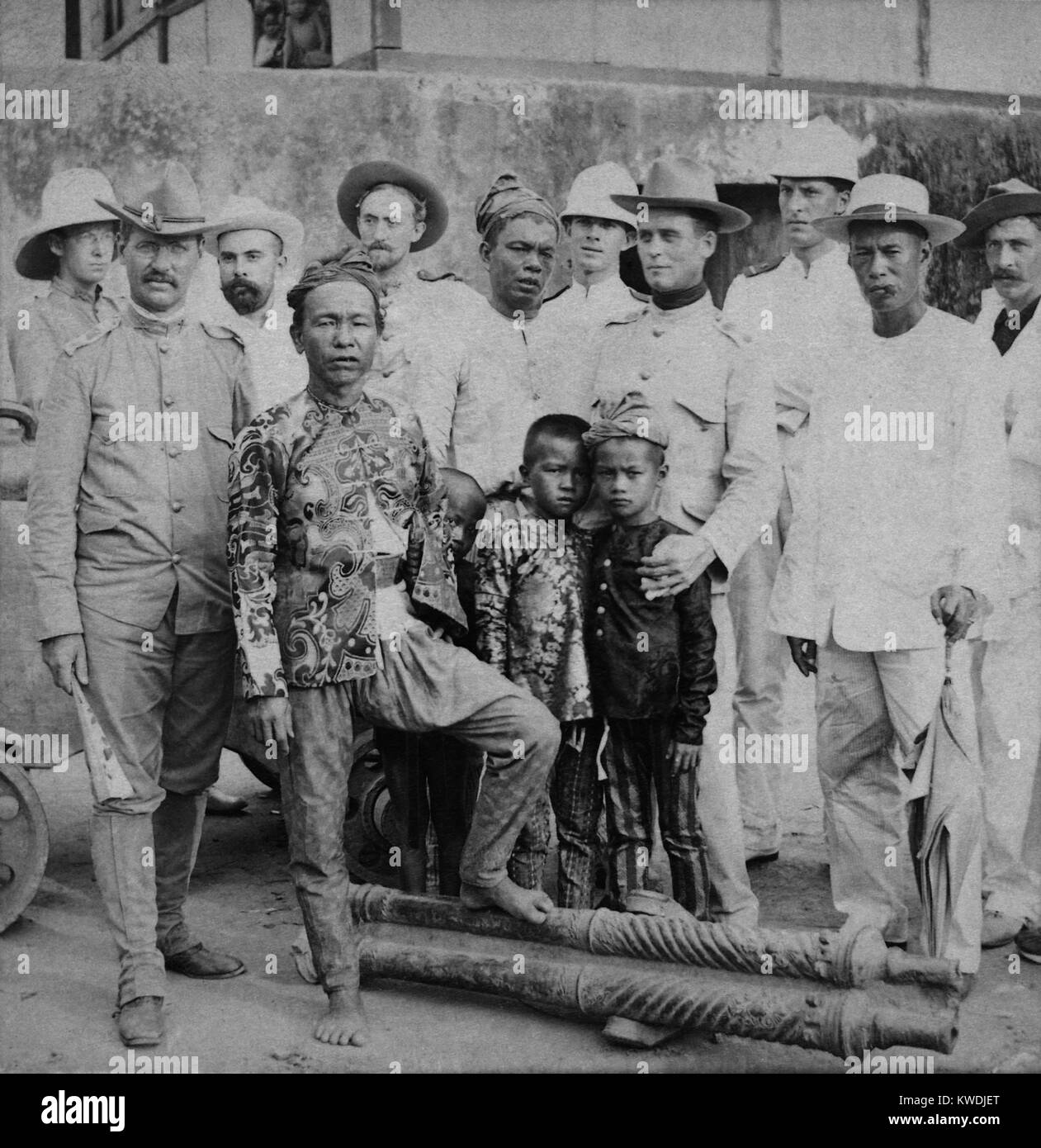 Datu Piang, chief of 10,000 followers in the Colabato hills of Mindanao, Philippine Islands, with American Officers. Ca. 1899-1900. He was a non-royal son of a Chinese father and Moro mother who accepted American authority without strife (BSLOC 2017 10 94) Stock Photo
