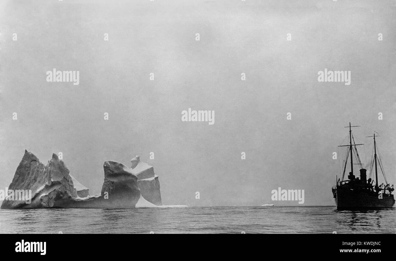Ship passing an iceberg larger than the vessel. 1910-17, probably in the North Atlantic Ocean (BSLOC 2017 17 107) Stock Photo