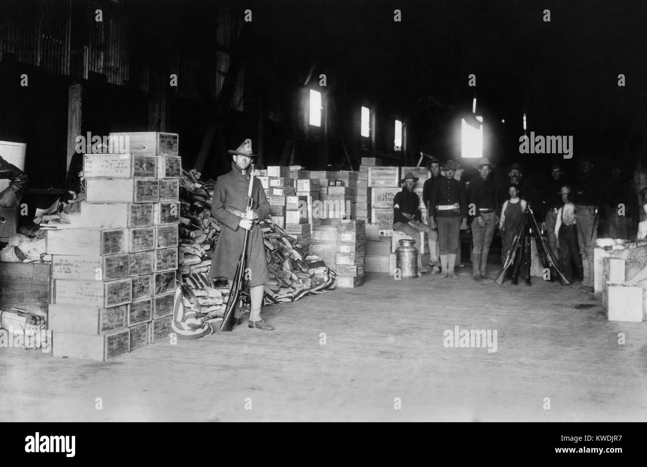 Soldiers guarding relief supplies in San Francisco after the April 1906 earthquake. By April 30, the Army set up nine food depots to distribute rations to 300,000 people. Each civilian was fed the equivalent of three-quarters of an enlisted mans rations (BSLOC 2017 17 39) Stock Photo
