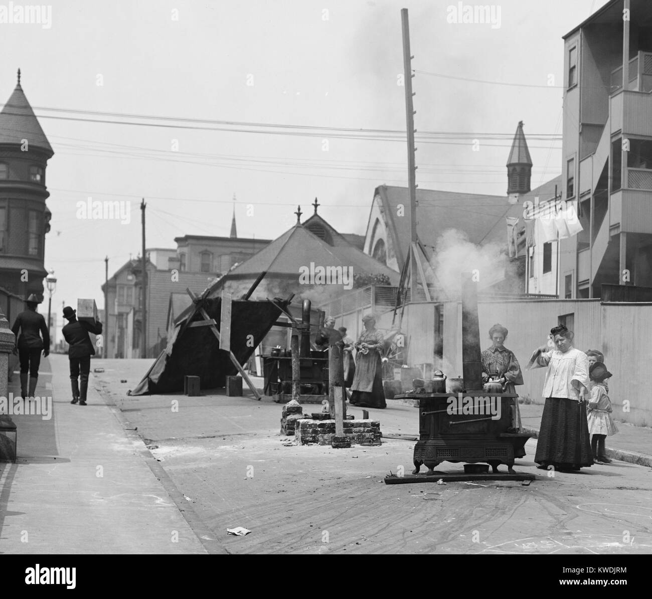 Women cooking in the street, after the April 18, 1906, San Francisco earthquake. Cooking in buildings was forbidden until houses were inspected for gas leaks that would case explosions and/or fires. (BSLOC 2017 17 46) Stock Photo