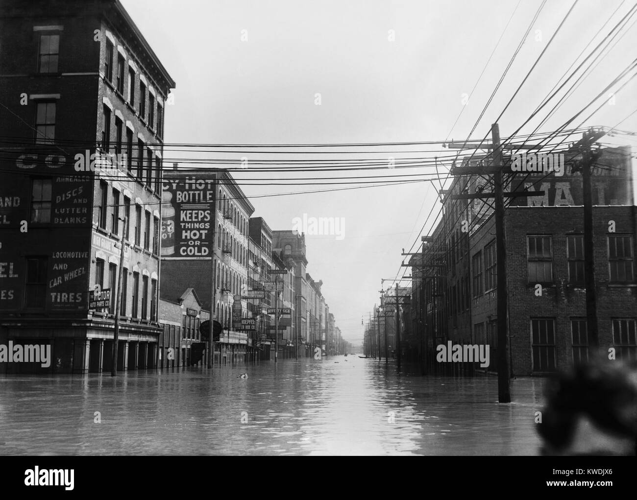 The Great Flood of 1913 was Ohios greatest weather disaster of the early 20th century. Photo shows flooded warehouses Elm St., looking north, Cincinnati, Ohio. A cropped head of a woman is in lower right (BSLOC 2017 17 94) Stock Photo